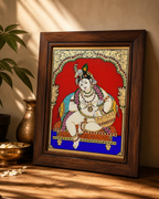 Tanjore Reverse Glass Painting of Krishna in a classic wooden frame with vibrant colors.