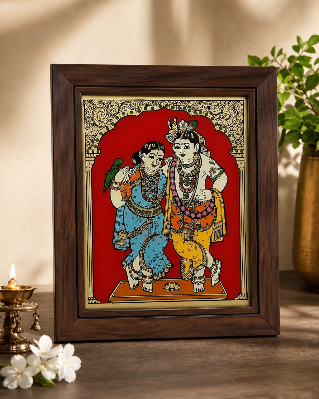 Tanjore reverse glass painting of Radha and Krishna in a wooden frame, decorative background