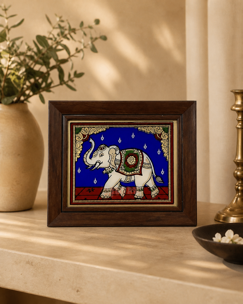 Tanjore reverse glass painting with elephant design in a wooden frame.