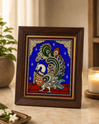 Framed Tanjore reverse glass painting of a peacock in vibrant colors
