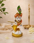 Exquisitely crafted Marble Dust Orange Krishna statue playing flute, with vibrant colors and intricate details for elegant home decor.