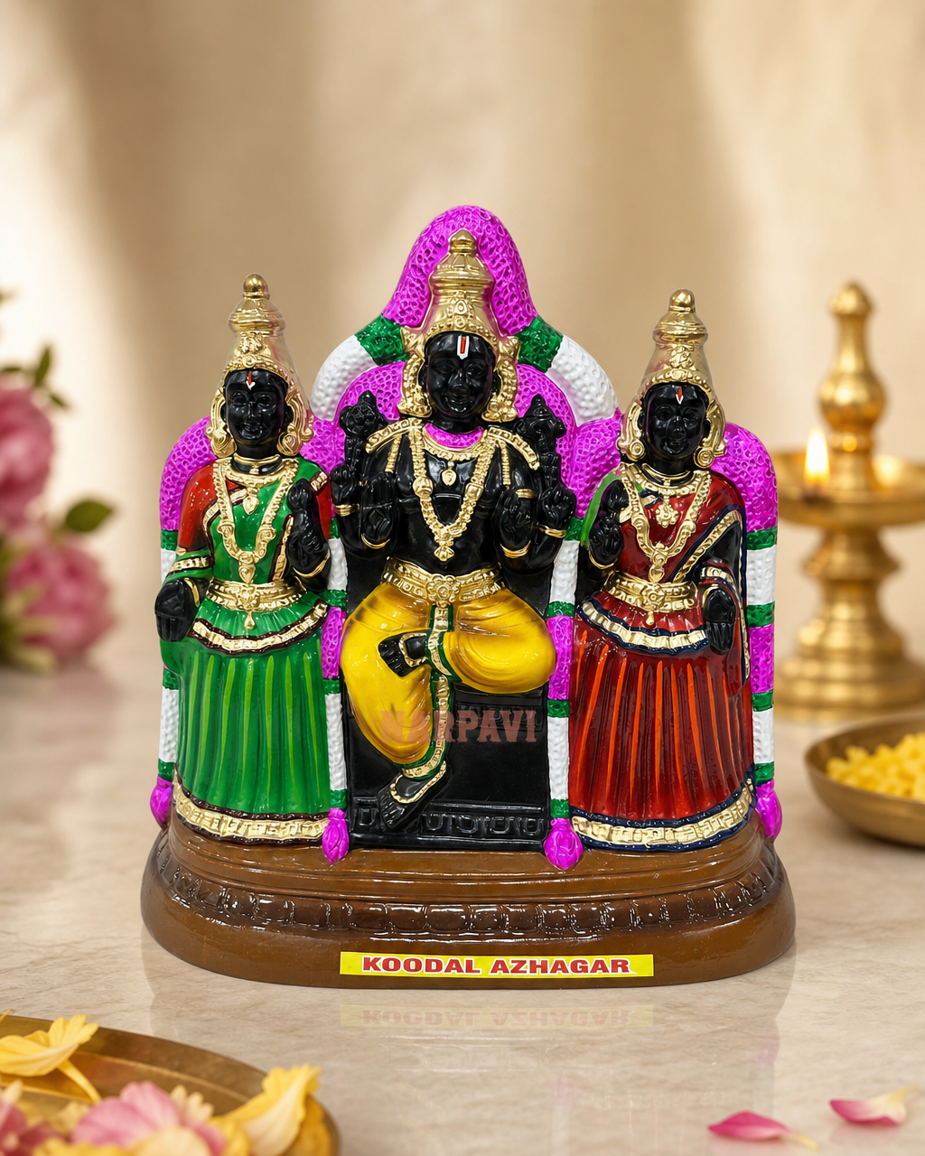 Colorful Koodal Azhagar deity figurine with intricate detailing and vibrant colors, set on a decorative base.