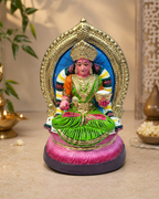 Mata Annapoorani Paper Mache statue in vibrant colors, seated with ornate detailing and surrounded by traditional decor.