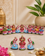Colorful Astalakshmi set of figurines displayed with decorative elements