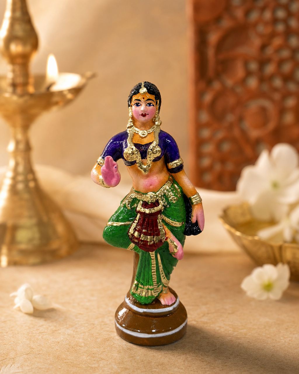 Elegant Bharatanatyam dancer figurine with vibrant attire, perfect for decor.