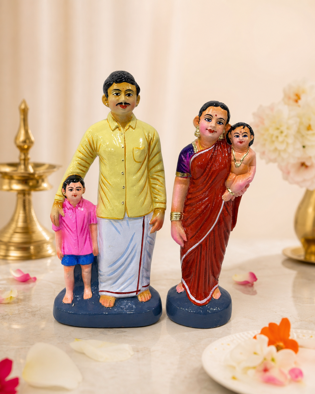 Colorful family figurine set depicting parents and children in traditional attire