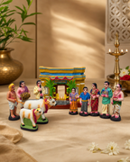 Colorful Grahapravesam set with figures and house, made from paper mache