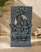 Intricate decorative statue of Lakshmi Narasimha on a table.