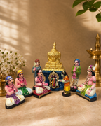 Colorful Madurai Meenakshi Muthumalai figurine set with temple backdrop
