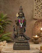 Intricate statue of Murugan with a peacock, showcasing detailed craftsmanship.