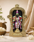 Intricately designed Pushpangi Meenakshi statue with vibrant colors, set in an opulent frame