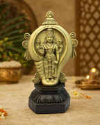 Sangumaha Vishnu statue with intricate detailing, set on a decorative base, surrounded by warm ambient lighting and traditional decor elements.