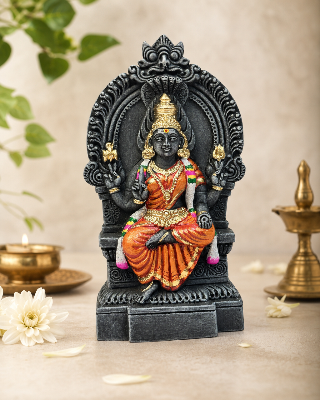 Intricately crafted Thiruvatchi Mariamman statue with vibrant traditional attire, surrounded by elegant decor elements.