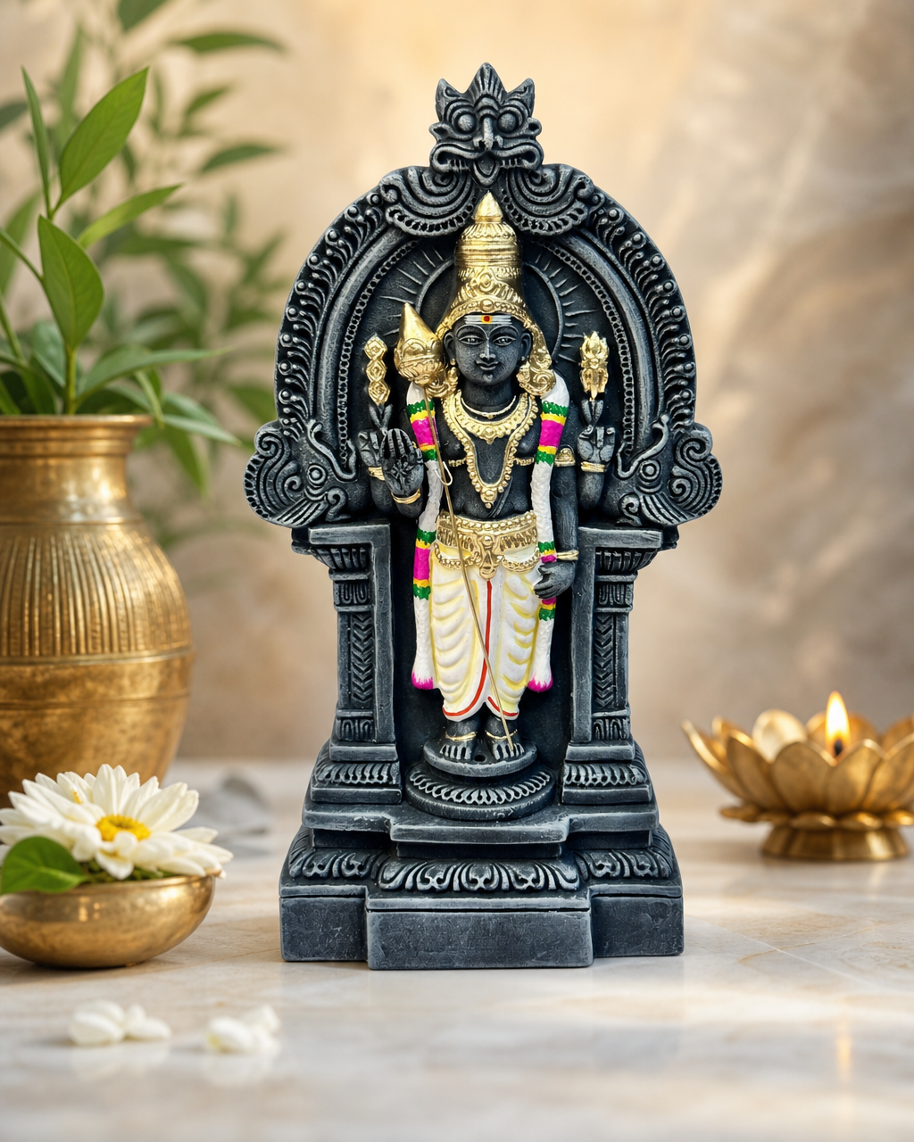 Thiruvatchi Muruga statue with intricate detailing and traditional design, surrounded by flowers and candles on a decorative table.