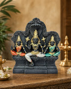 Beautiful Vaikundanathar statue with intricate details, set on a wooden table with traditional decor in the background.