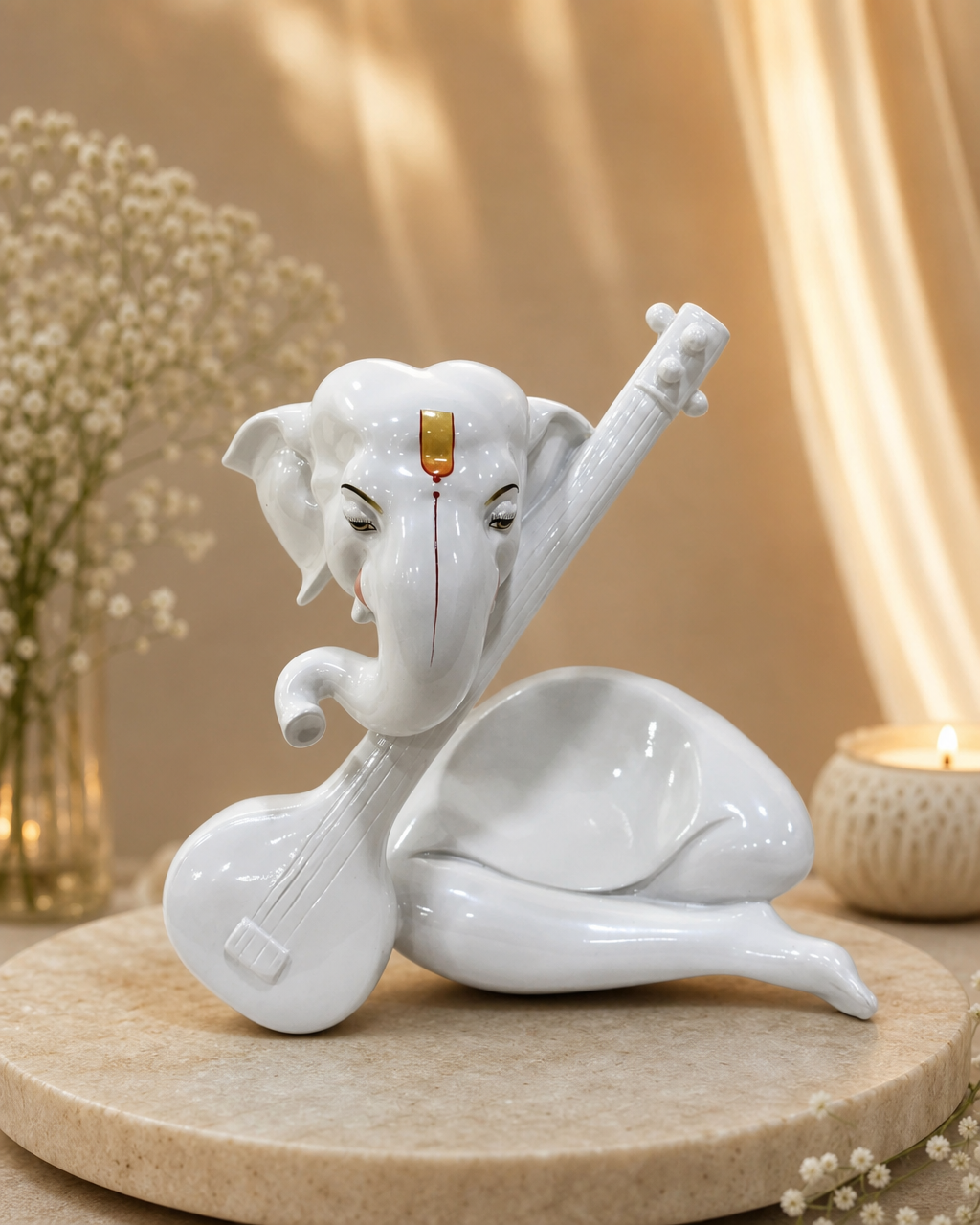 Elegant white Ganesha sculpture holding a Veena, placed on a circular base with delicate floral decor.