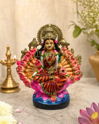 Colorful and detailed Maha Lakshmi statue with vibrant attire and intricate craftsmanship.