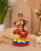 Colorful Balambigai figurine on a decorative surface with intricate details.