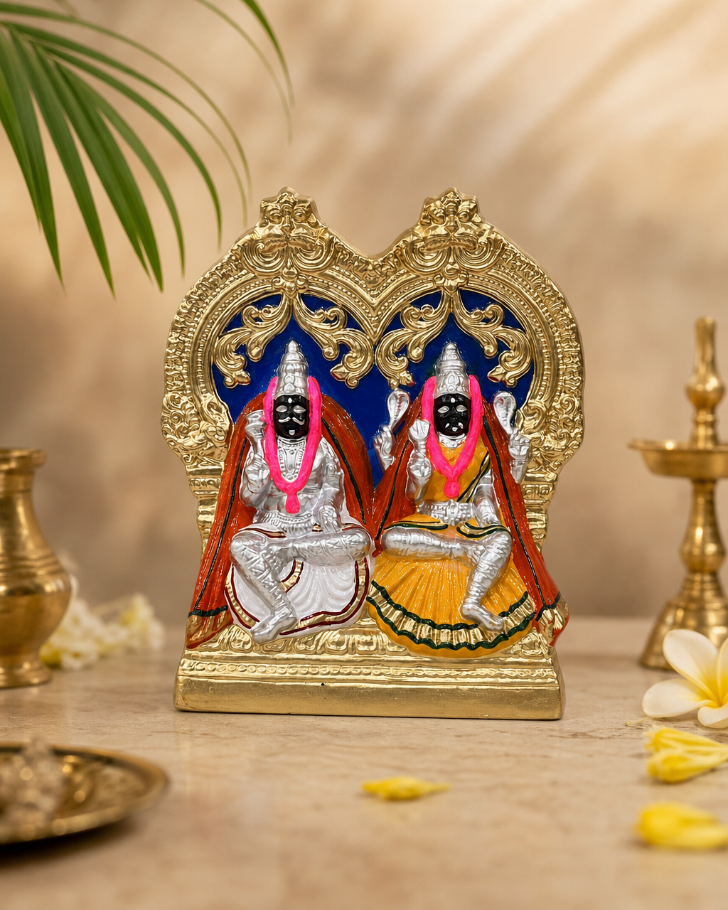 Intricate Mutharamman Paper Mache sculpture with vibrant colors and detailed craftsmanship.