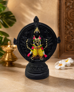Chakrathalvar sculpture with intricate black detailing and vibrant decorative elements, ideal for home décor.