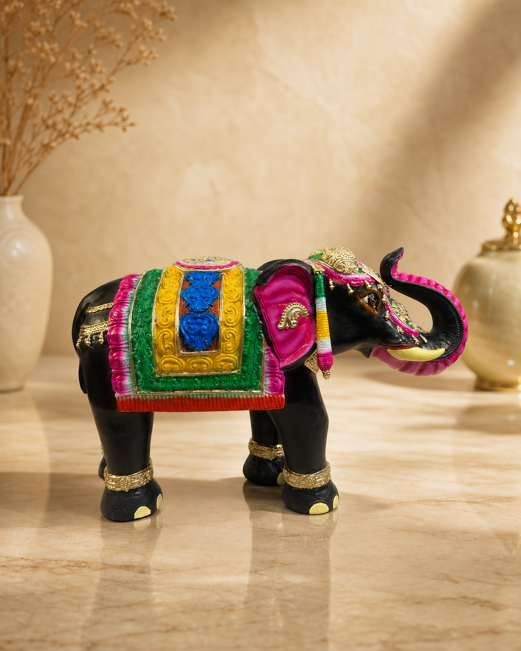 Colorful Ambari elephant statue with intricate details on a marble surface