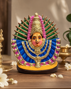 Colorful Elamma decorative idol with intricate details and vibrant colors, perfect for home decor.