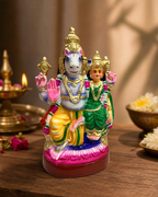 Colorful Lakshmi Hayagriva medium statue surrounded by traditional decor elements.