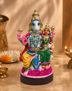 Colorful statue of Lakshmi Hayagrivar in ornate attire, seated and holding symbolic items, with intricate details.