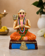 Ramanujar figurine with intricate detailing on a decorative base