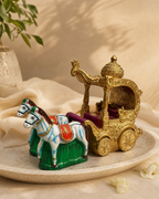 Decorative Ratham Kuthirai display set featuring ornate gold carriage and two horses on a ceramic plate.