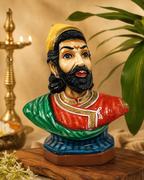 Colorful bust sculpture of Veera Shivaji with intricate detailing.