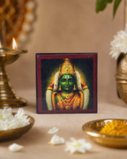 Decorative Kum Kum Box with traditional religious artwork and brass pooja items.